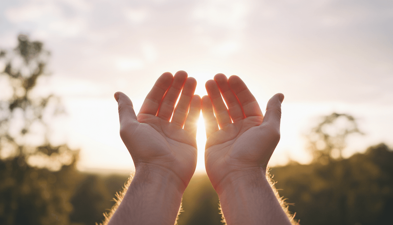 Hands reaching upward in a gesture of faith and hope